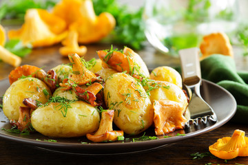 Fried potatoes with chanterelle mushrooms.