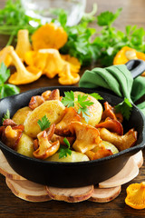 Fried potatoes with chanterelle mushrooms.