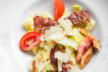 Caesar salad with chicken and tomato