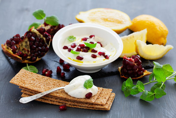 The sauce (dip) of yogurt with pomegranate and mint