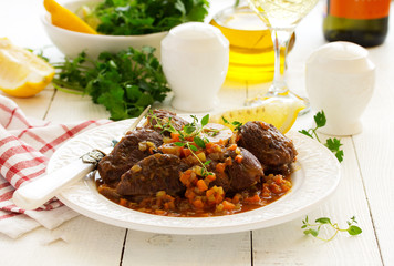 ossobuco with polenta on the Milanese. Italian Cuisine.