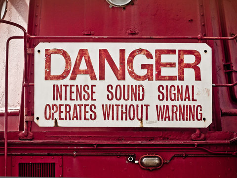 "Danger, intense sound signal". Warning sign on the Trinity House Light Vessel No. 94, exhibited at the former NDSM shipyard in Amsterdam, The Netherlands.
