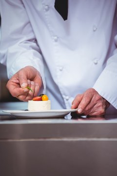 Chef Putting Finishing Touch On Dessert