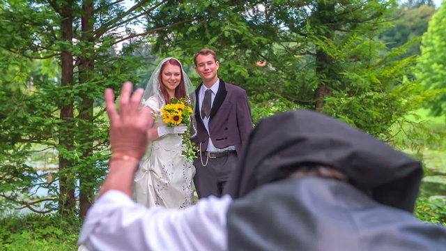 A photographer taking a wedding photo