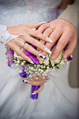 Fototapeta premium Wedding couple hands with rings
