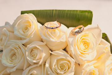 Wedding rings and bridal bouquet