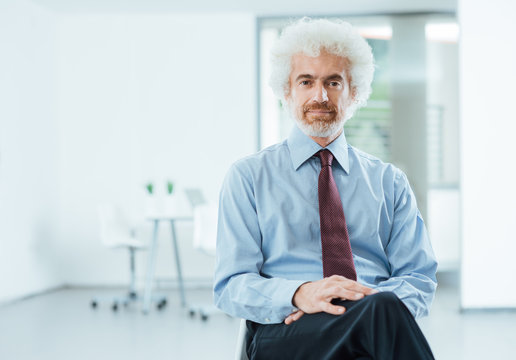 Confident businessman posing in the office