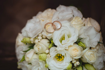 Wedding rings and bridal bouquet
