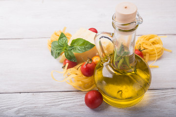 raw pasta, green basil and chesse
