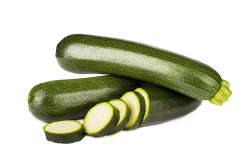 Fresh vegetable zucchini and slices isolated on white background