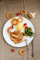 Fish with onion rings and rosemarry