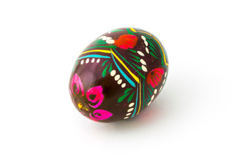 Wooden easter egg souvenir on white background