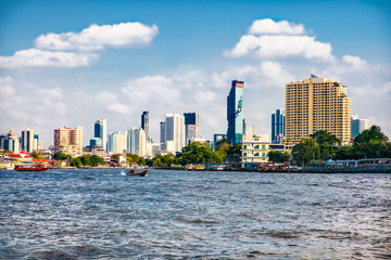 Business district from Jaopraya river in Bangkok, Tailand.