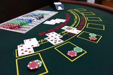 Black Jack table with cards and tokens - obrazy, fototapety, plakaty