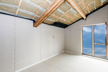 Rroom under construction with gypsum plaster boards.