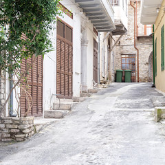 Vanishing street with vintage buildings. Pano Lefkara, Cyprus.
