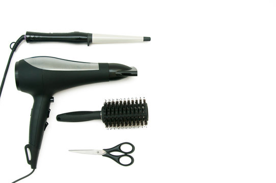 Collection of curling iron, hair dryer, comb and scissors
