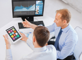 businessmen tablet pc using applications at office