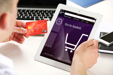 Man shopping online with digital tablet