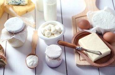Fototapeta na wymiar Set of fresh dairy products on white wooden table