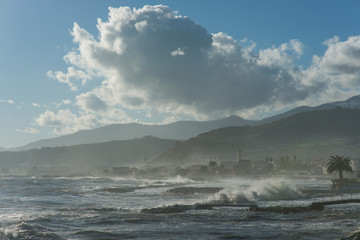 Fototapeta na wymiar View of Santo Stefano al Mare during a sea storm, Ligurian Riviera, Italy