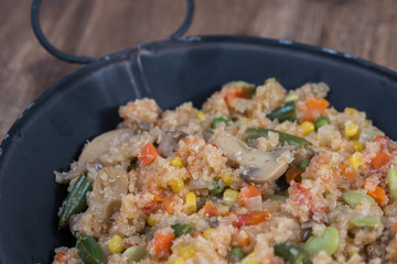 Close macro cooked quinoa with vegetables