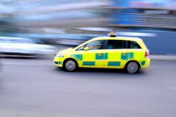 Fototapeta na wymiar Blurred emergency car as a speed concept