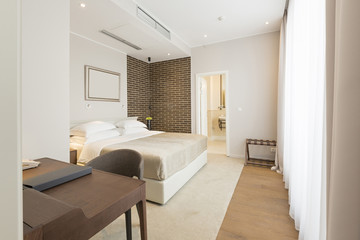Fototapeta na wymiar Interior of a double hotel bedroom in the morning