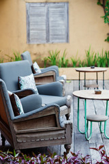 Outdoor patio seating with nice bench chairs at sunset