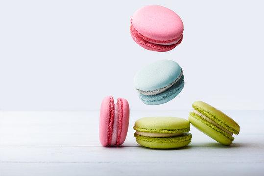 macaroons in motion on white background