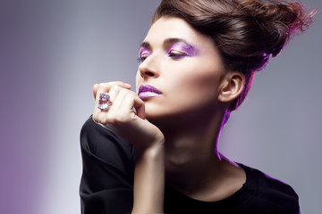 Glamour portrait of beautiful fashion model posing in exclusive jewelry. Professional makeup and hairstyle