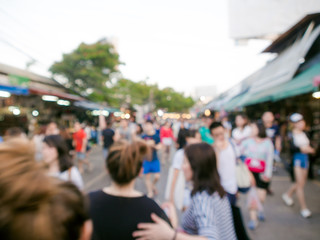 Blurred people shopping at outdoor weekend market fair