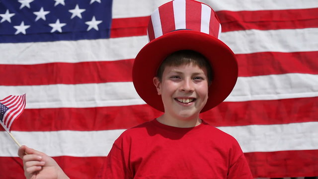 Boy waving American flag