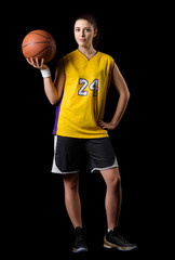 Fototapeta premium Young girl basketball player