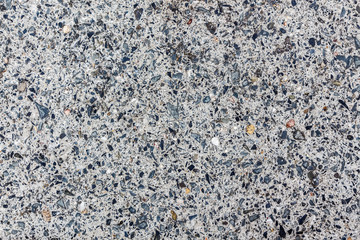 Stone slab with small inclusions. Grey texture. Can be used as background
