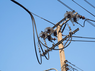Chaotic wire and concrete electricity post