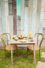 Breakfast in the garden with coffee and a simple food. Good mood