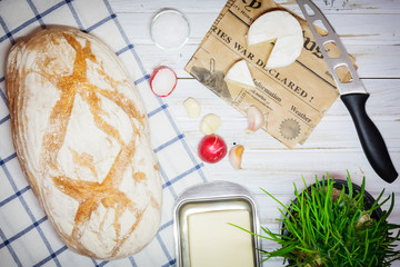 Fresh snack with camembert cheese on an old wooden table