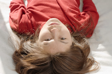 Girl upside down looking portrait