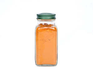 Organic turmeric powder on white background