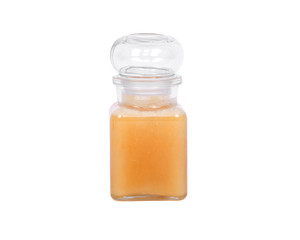 Honey in jar on white background