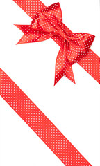 red bow with polka dots isolated on white background © Timmary