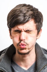 Obraz premium Grimacing Man in Pain