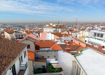    panorama metropolitan Madrid Spain Europe with red tile roof condos offices and Cathedral