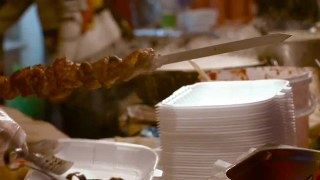 Cooking Meat on Skewers in the Street Festival