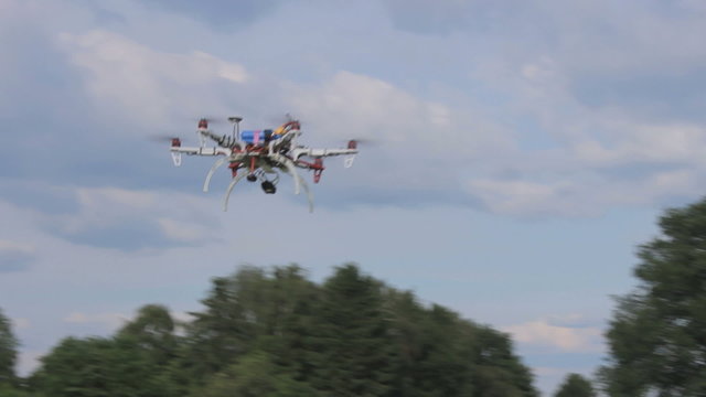 Drone starts  flying in the sky, view from the bottum up