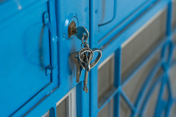 key in hold key on blue steel door