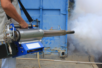 Obraz premium Fogging mosquito in the arround of container