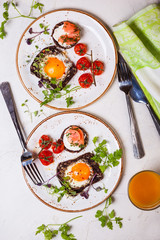 Fried eggs, salmon canape and  tomatoes