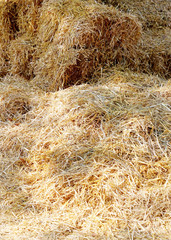 Summer background of hay from stack. Haystack closeup as a backg